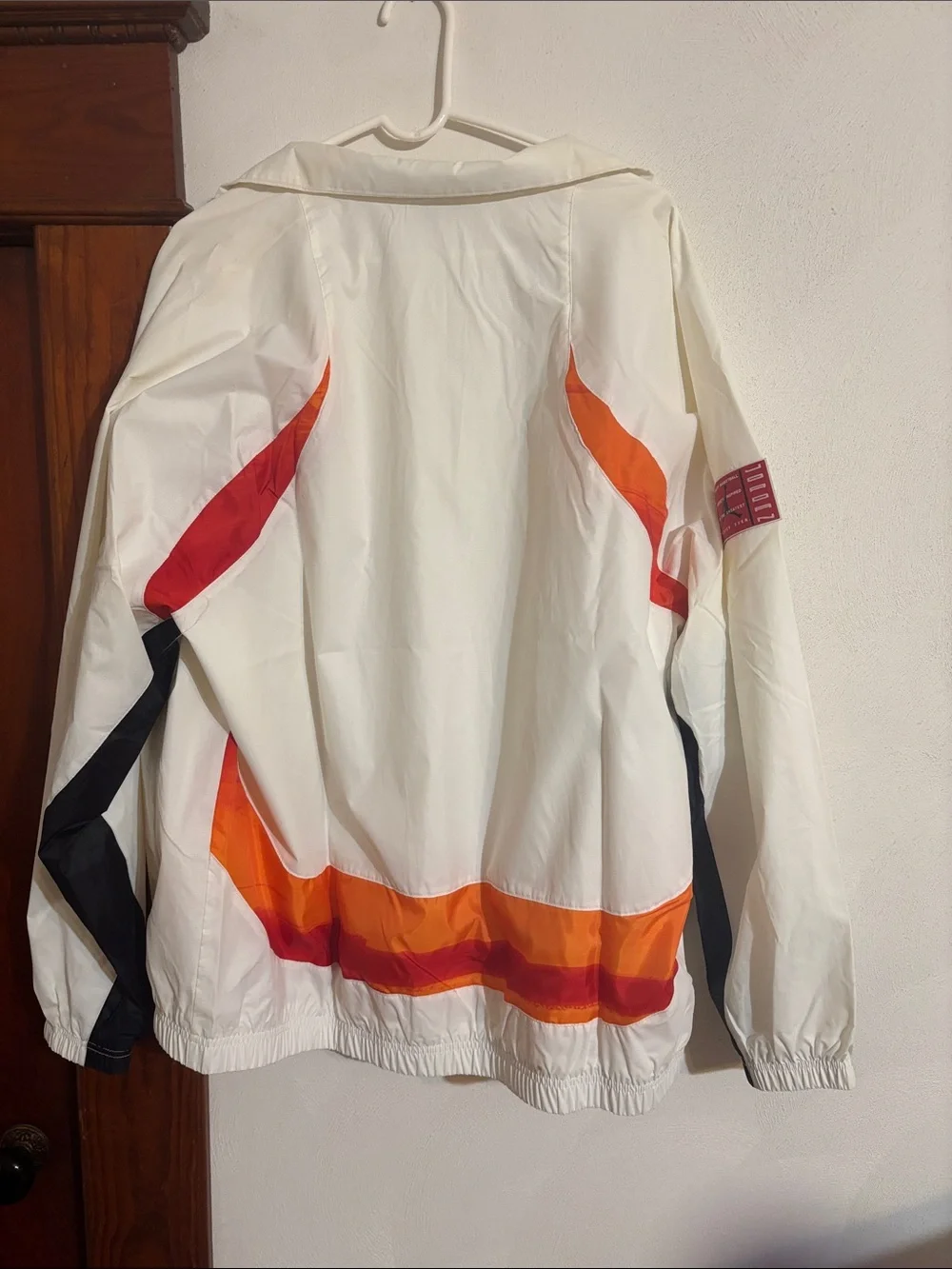 Jordan White Windbreaker with Orange and Red Accents